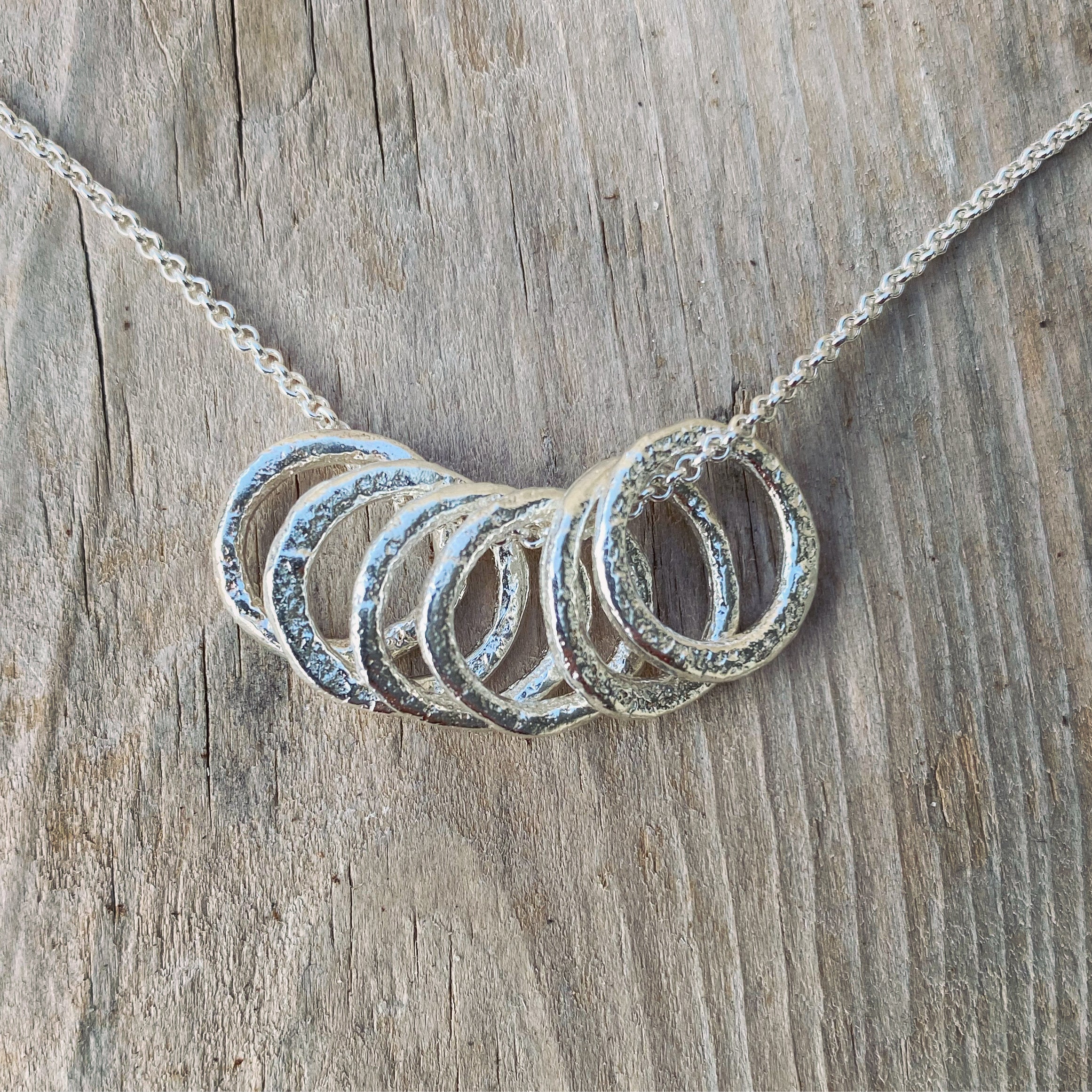 Evolution Tapestry Needle Pendant